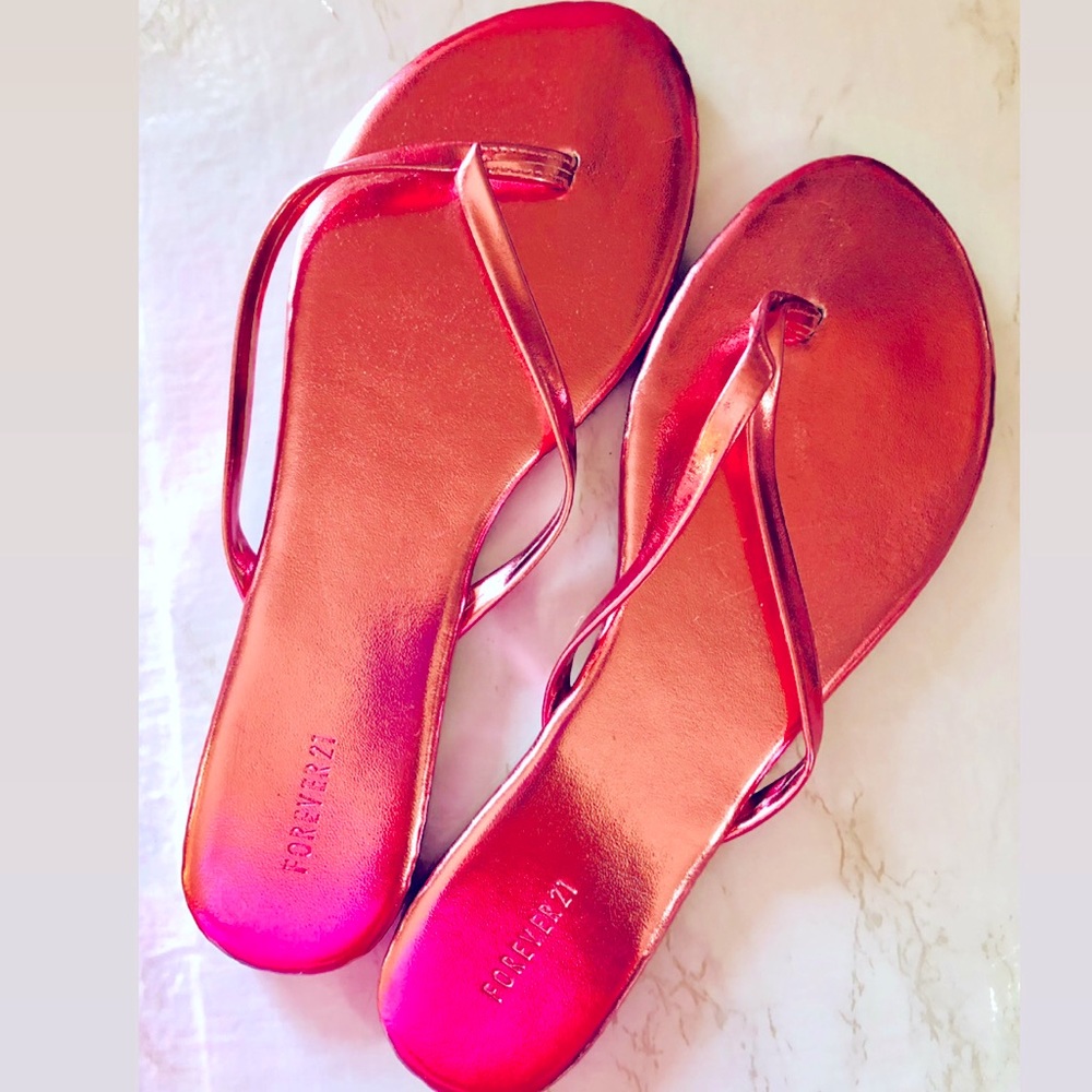 Pink metallic flip flops